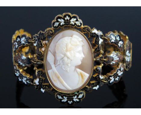 An Antique Shell Cameo Bracelet decorated with a classical female bust and in a gilt and enamel setting with foliate decorati