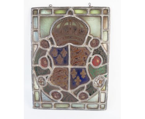 A stained glass panel depicting the Royal Coat of Arms for Richard III enclosed by red and white roses, 34 x 25cm 