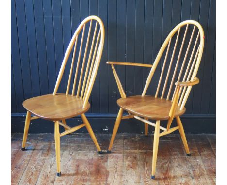 An Ercol blonde Quaker elbow chair  and standard dining chair, with arched spindle backs and spindle tapering legs linked by 