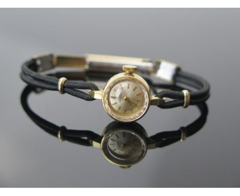 A Ladies Girard Perregaux 18K Gold Wristwatch with 15mm case and 17 jewel manual wind movement no. 5109 806, case back weighs