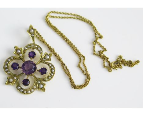 An Amethyst and untested Pearl Pendant in an unmarked high carat gold setting and on a 15.5" (40cm) chain with indistinct mar