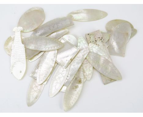 A collection of 19th century Cantonese export mother-of-pearl gaming counters, various shapes including fish, ovals and recta