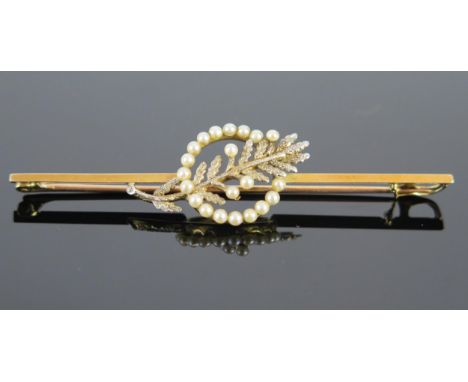 An Edwardian gold and pearl (untested) bar brooch, a ring of circular seed pearls with white interlaced olive branch, stamped