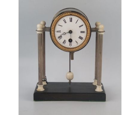 An Art Deco period chrome and faux ivory mantel timepiece, with 8cm Roman dial, raised on four plain columns on an ebonised b