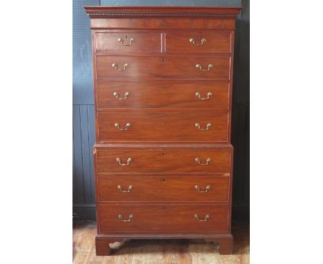 Georgian mahogany chest on chest, with dentil moulded cornice above two short and three long drawers , the base containing a 