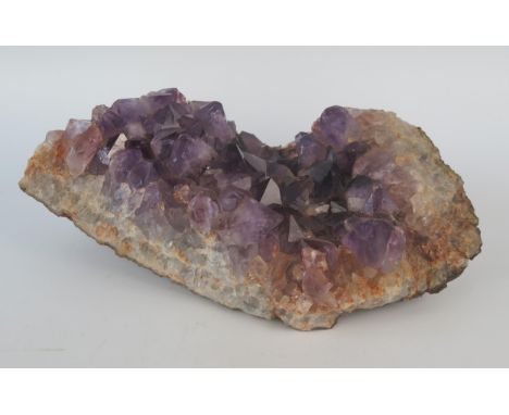 A section of an amethyst geode, 28cm long. 