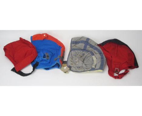A possibly RAAF bail-out cap/High vis flying helmet, together with two other canvas helmets, (3). 