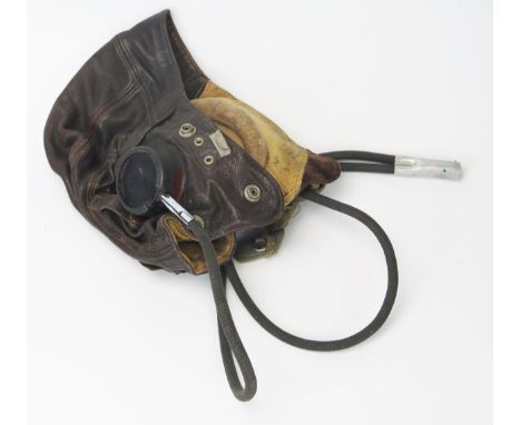 A WWII RAF C Type brown leather flying helmet, with Gosport tubes, worn stamp marks to liner. 