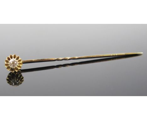 A Diamond Stick Pin in an unmarked yellow metal setting, the old cut stone c. 4mm, 1.9g. Cased 