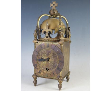 A George VI coronation period brass lantern clock, with 11.5cm circular Roman dial, centered with Royal Coat-of-Arms, the mov