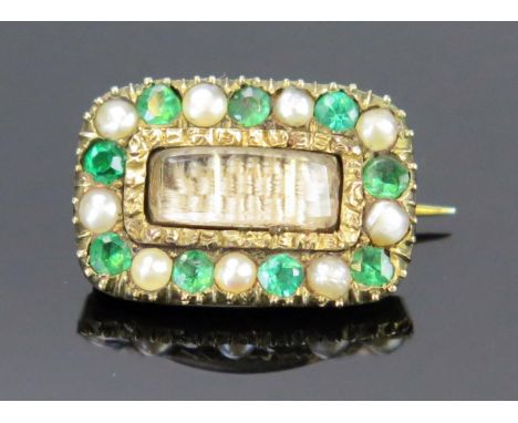 A Small Georgian untested Pearl and Foil Back Green Paste Memorial Brooch with central glazed panel having platted hair and i