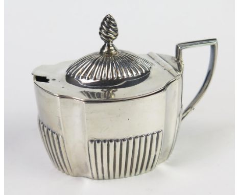 A Victorian silver mustard pot and cover, maker Harrison Brothers &amp; Howson, Sheffield, 1895, of barge-shaped outline with