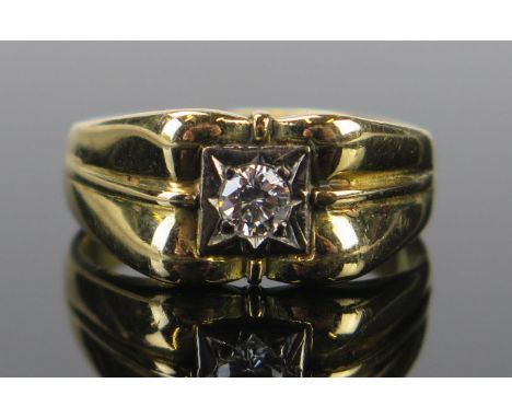 A Gent's 18ct Gold and Diamond Solitaire Ring, the c. 4mm brilliant round cut estimated at .25ct, London 1975, size R.75, 8.5