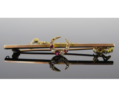 An Unmarked Gold, Ruby and Diamond Crescent Bar Brooch with safety chain, 57.5mm long, 3.2g 