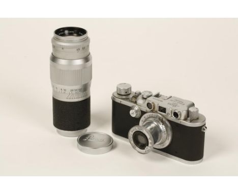 A 1950's LEICA CAMERA, number 331224, in original leather case with loose Leica lens, HEKTOR F=13.5CM 1:4.5 NR. 1508022. In o