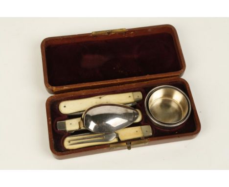 A 19TH CENTURY CAMPAIGN EATING SET with folding spoon, fork, knife and cup, contained in original leather case