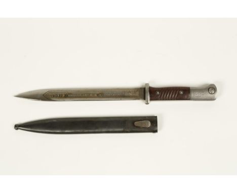 A SECOND WORLD WAR NAZI SS BAYONET with scabbard, engraved on each side of the blade "33 Kanallerie" and Charlemagne"and "Mei