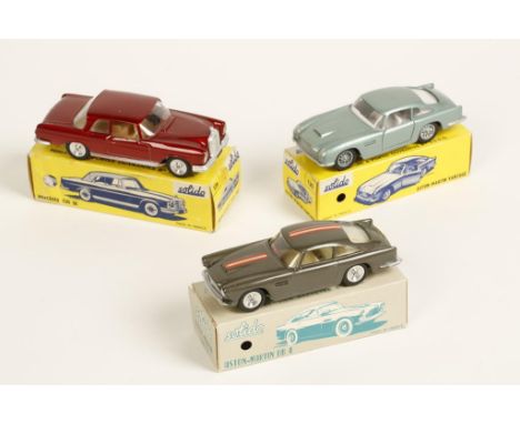 A SOLIDO ASTON-MARTIN DB4, a Solido Aston Martin Vantage, number 130, and a Solido Mercedes 220 SE, number 126. Both in boxes