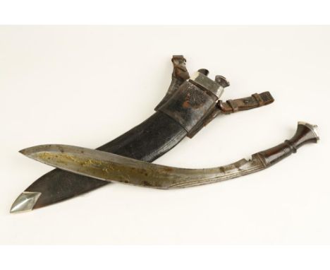 A LATE 19TH/EARLY 20TH CENTURY INDIAN KUKRI with wooden grip and silver mounts, in a leather and silver mounted scabbard, 19.