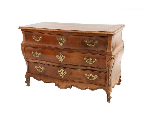 A French Louis XV Period Provincial Walnut Commode, 3rd quarter 18th century, of serpentine-shape form, with three deep drawe