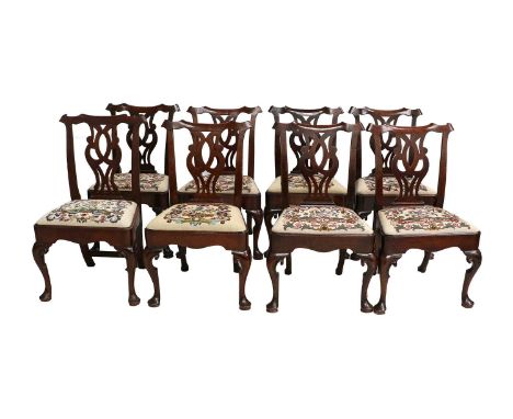A Set of Six George III Chippendale Period Mahogany Dining Chairs, circa 1760, covered in later needlework fabric, the curved