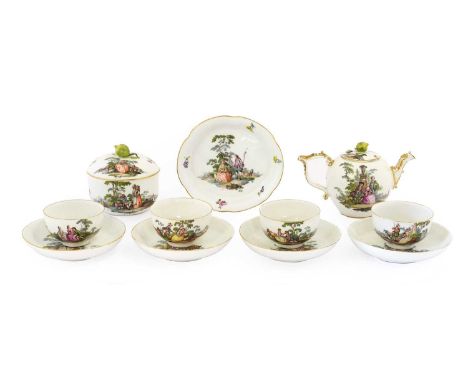 A Meissen Porcelain Tea Service, circa 1755, painted with romantic figures in landscape within gilt line borders, crossed swo