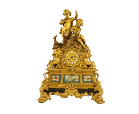 An Ormolu and Porcelain Striking Mantel Clock, circa 1870, surmounted by figures holding fishing nets, base with blue porcela