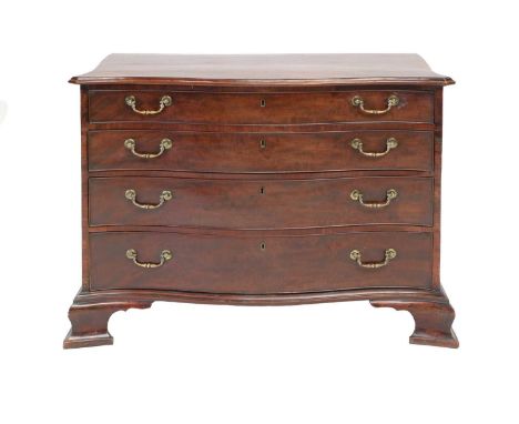 A George III Mahogany Serpentine-Shape Commode, circa 1780, the moulded top above four oak-lined drawers with original brasse