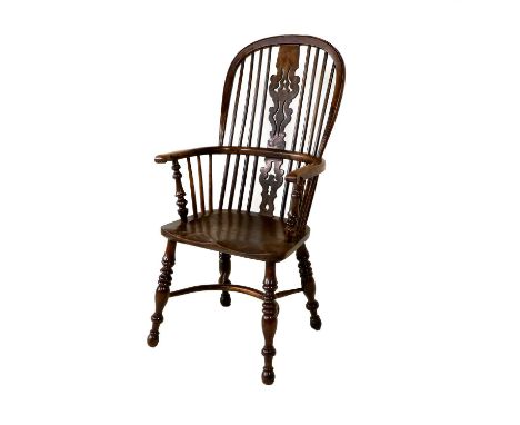 A Mid 19th Century Yewwood High-Back Windsor Armchair, the double spindle back support and pierced splat above moulded hand g