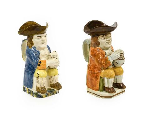 A Prattware Toby Jug, circa 1800, of traditional form, the seated figure holding a jug of ale25cm highA Similar Toby Jug25.5c