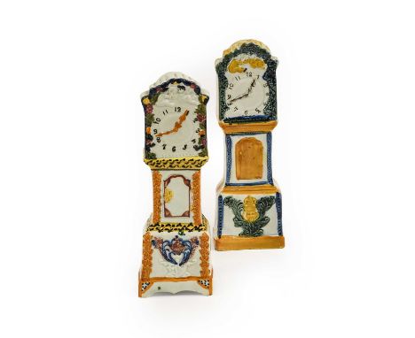 ^ A Prattware Model of a Longcase Clock, circa 1810, with foliate cresting over two putti flying above the clock face, the tr