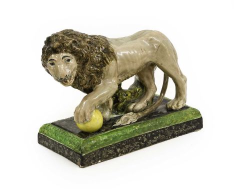 ^ A Pearlware Model of the Medici Lion, circa 1810, naturalistically modelled and painted, its left forepaw on a yellow ball,