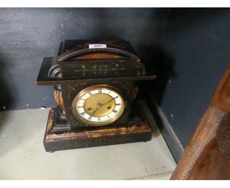 A Victorian marble effect wooden mantel clock.