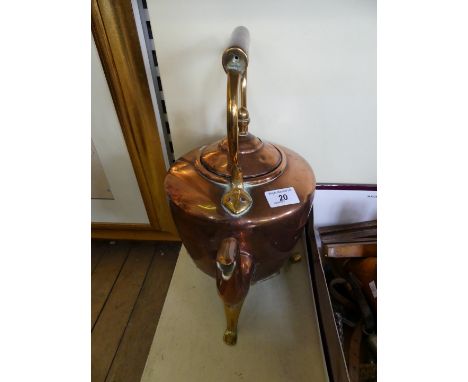 A Georgian copper tea kettle on stand raised on brass teapot stand 