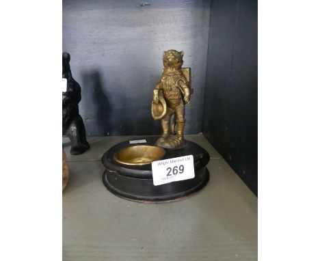 A vintage gilt spelter table ashtray model in a form of a cat carrying luggage and top hat 