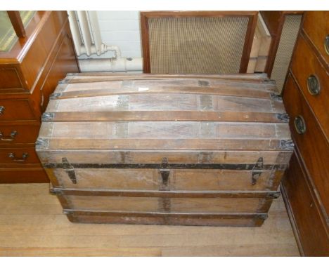 A Vintage wooden applied domed top trunk.