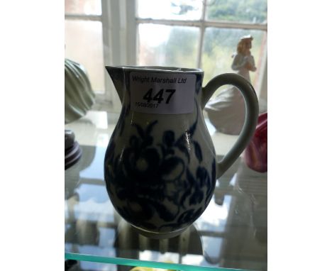 An 18th Century Worcester blue and white sparrow beak jug decorated with floral sprays possibly Mansfield pattern on an ivory