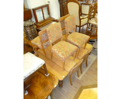 A late Victorian light oak dining suite, comprising extending dining table, complete with two extra leaves, eight oak framed 