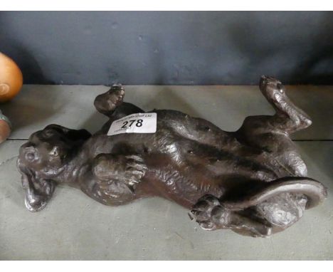 A decorative bronzed model of a Dachshund.