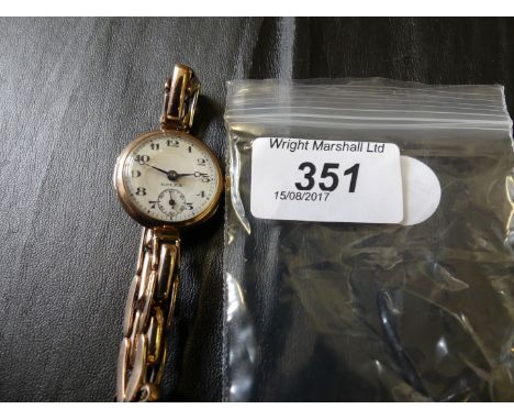 An early 20th century ladies Rolex 9k gold manual wind wristwatch, to an expandable strap, gross weight approx. 21g
