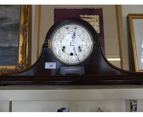 An early 20th Century mahogany Napoleon hat shaped mantle clock 