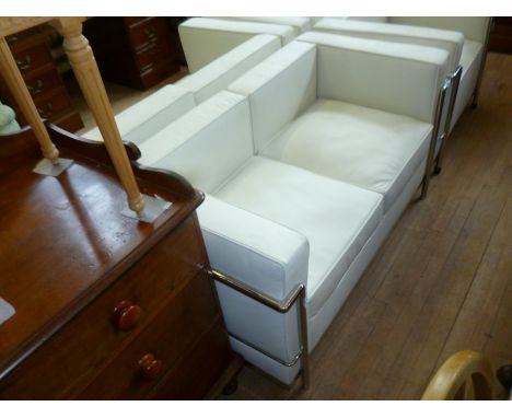 A modern Le Corbusier white two seater sofa with chrome frame.AUCTIONEERS NOTE: THIS ITEM IS BRAND NEW AND LEATHER