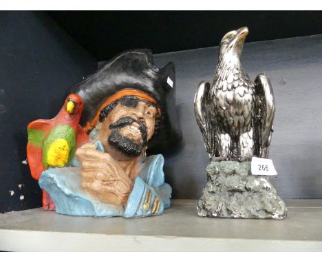 A Universal Statuary Corporation model of Long John Silver circa 1974 together with a silvered model of an eagle.