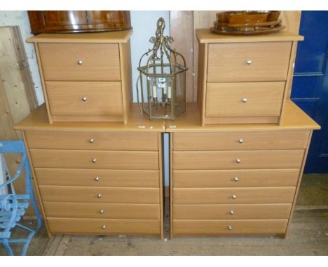 A stylish contemporary light wood bedroom suite, comprising a pair of chests of six long drawers, and a pair of bedside chest