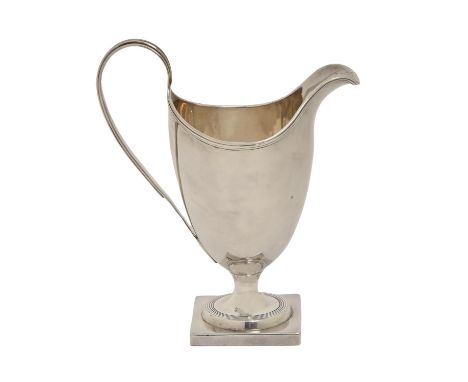 A George III silver cream jug,&nbsp; of helmet shape with reeded handle and rim, on square foot, 14.5cm h, by Samuel Meriton,