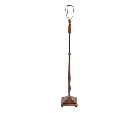 A George III mahogany pole screen adapted as a lamp, on associated stepped square foot with ebonised feet, 120cm (unextended,