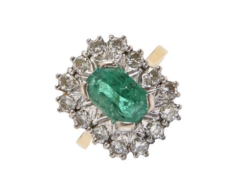 An emerald and diamond ring, the step cut emerald (6 x 9mm) in a surround of evenly sized round brilliant cut diamonds, in 18