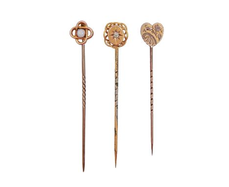 A diamond stickpin, an opal stickpin and another stickpin with heart shaped terminal, all c1900, in gold, 2.6g  Good conditio