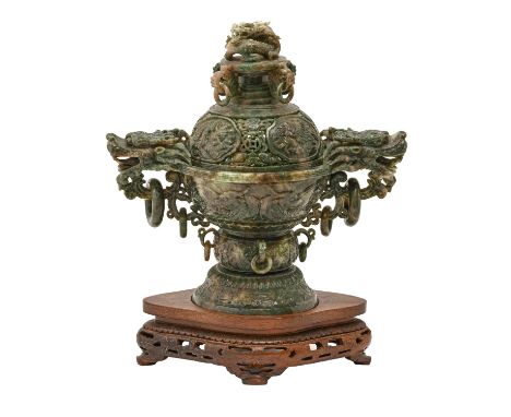 A Chinese spinach jade dragon handled incense burner and cover, late 20th c, with loose ring handles, wire inlaid wood stand,