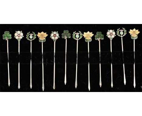 A set of twelve silver and enamel cocktail sticks, mid 20th c, with rose, thistle, shamrock or daffodil terminal, marked SILV